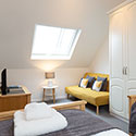 Bedroom with 2 single beds and a sofa bed